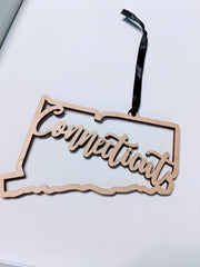 5 inch long by 3 inch high Connecticut ornament with ribbon