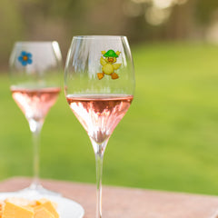 Stemless wine glasses accented with duck charms