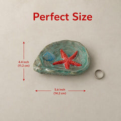 Heavy-duty ceramic spoon rest with shell accents