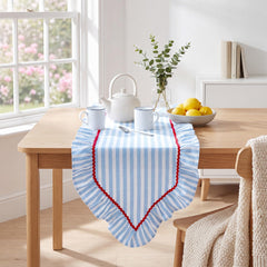Ruffled hem on blue and white striped table runner