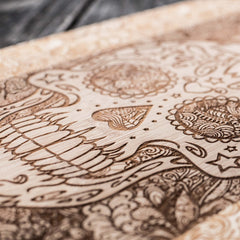 laser engraved sugar skull design on bamboo board