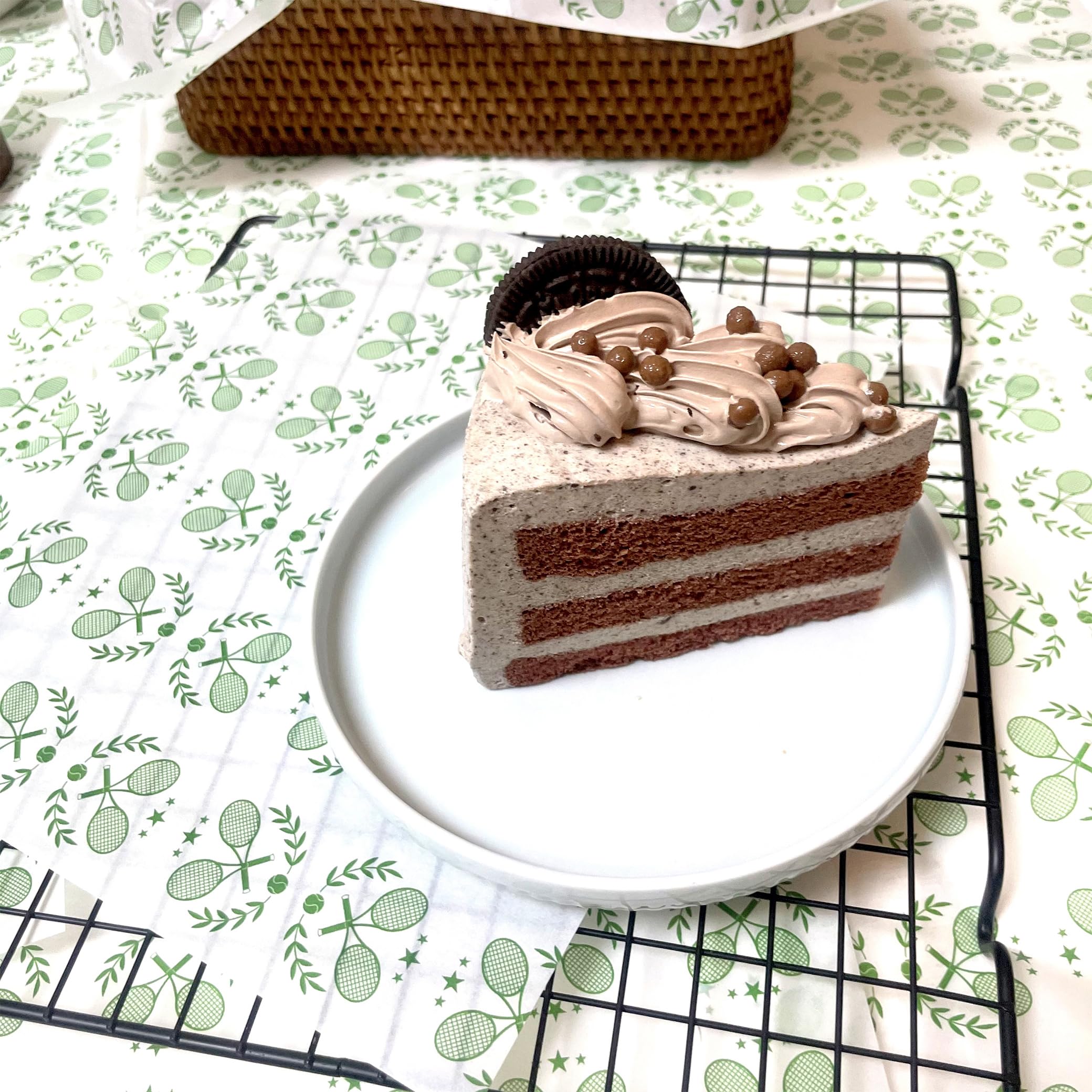 Food service wax paper with tennis pattern in green and white