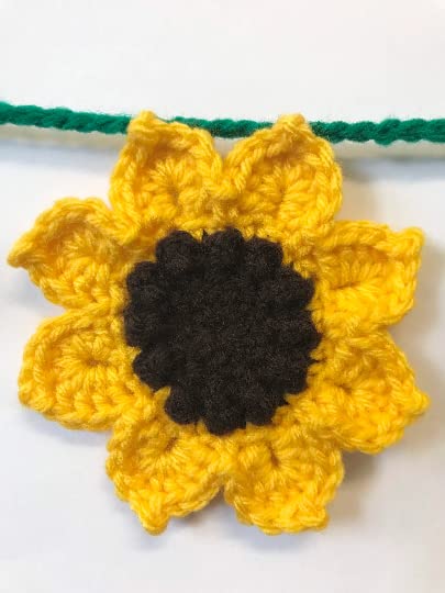 Close up of sunflower decor with yellow petals and brown centers