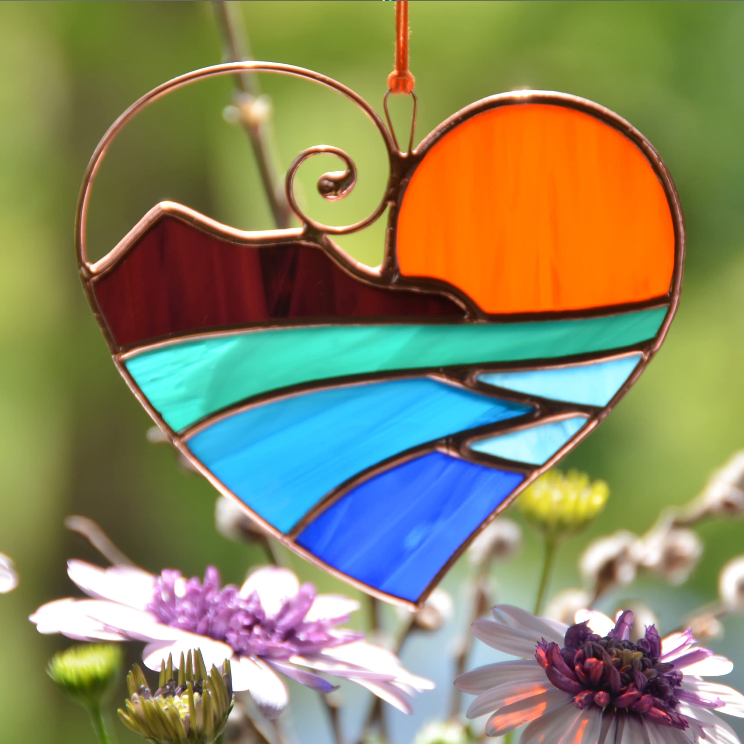 Sunset sea and mountains motif stained glass ornament
