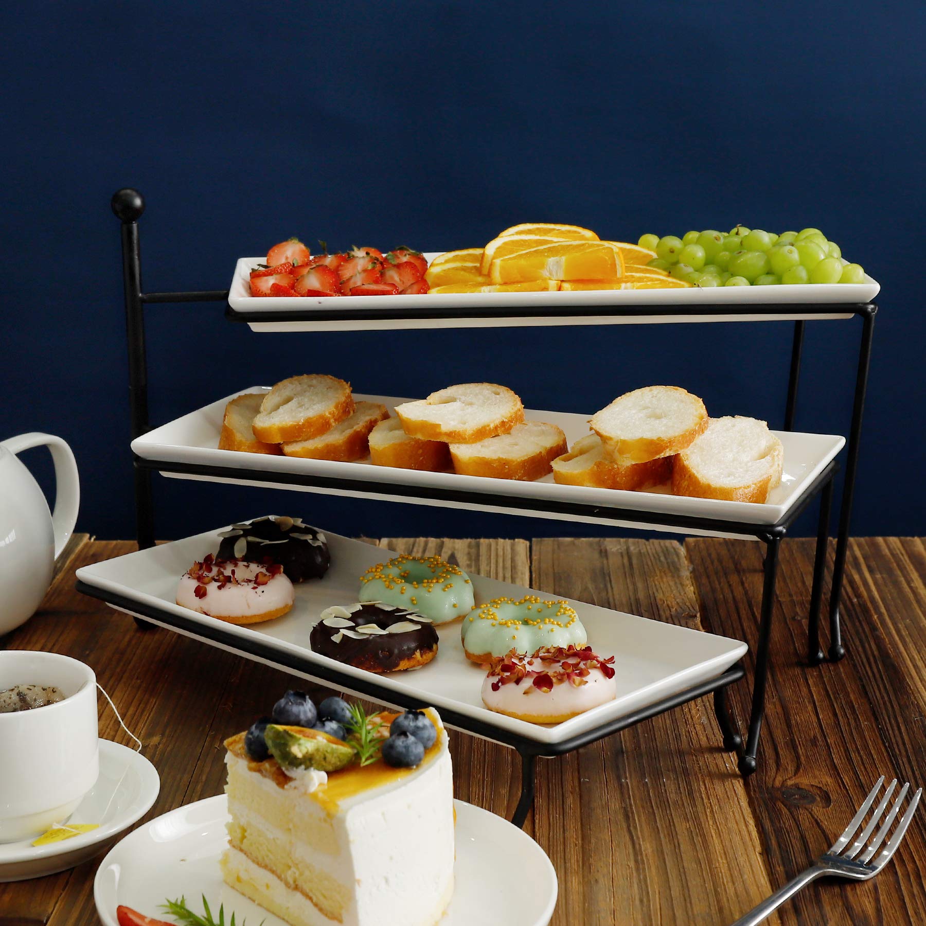 Dessert display with cupcakes and finger foods on Sweese stand