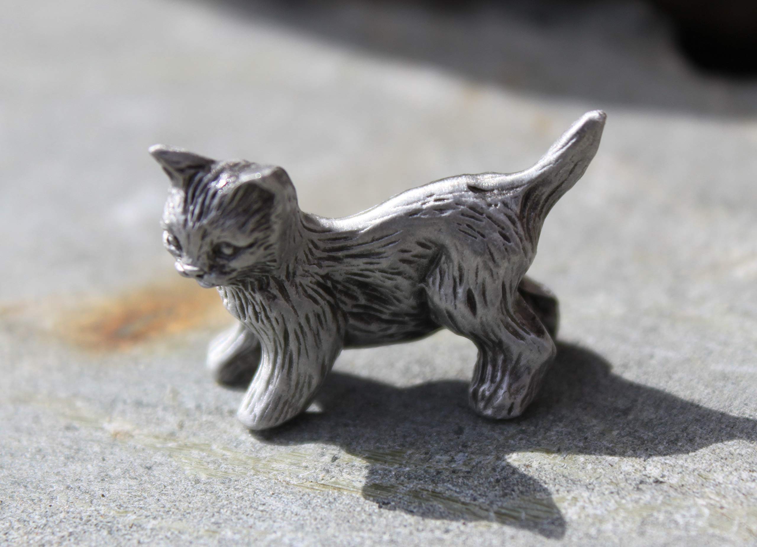 Packaging includes tag enclosed in clear package for kitten figurine
