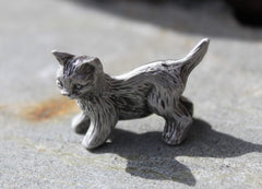 Packaging includes tag enclosed in clear package for kitten figurine