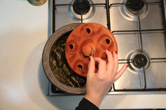 Terracotta plate with handle hole for hanging storage