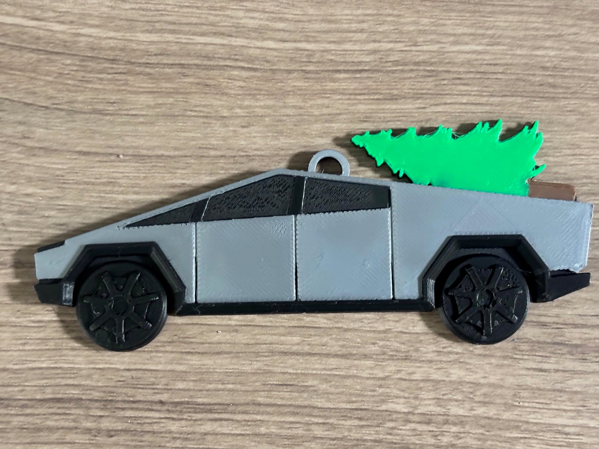 3D printed Cybertruck ornament with tree on top display