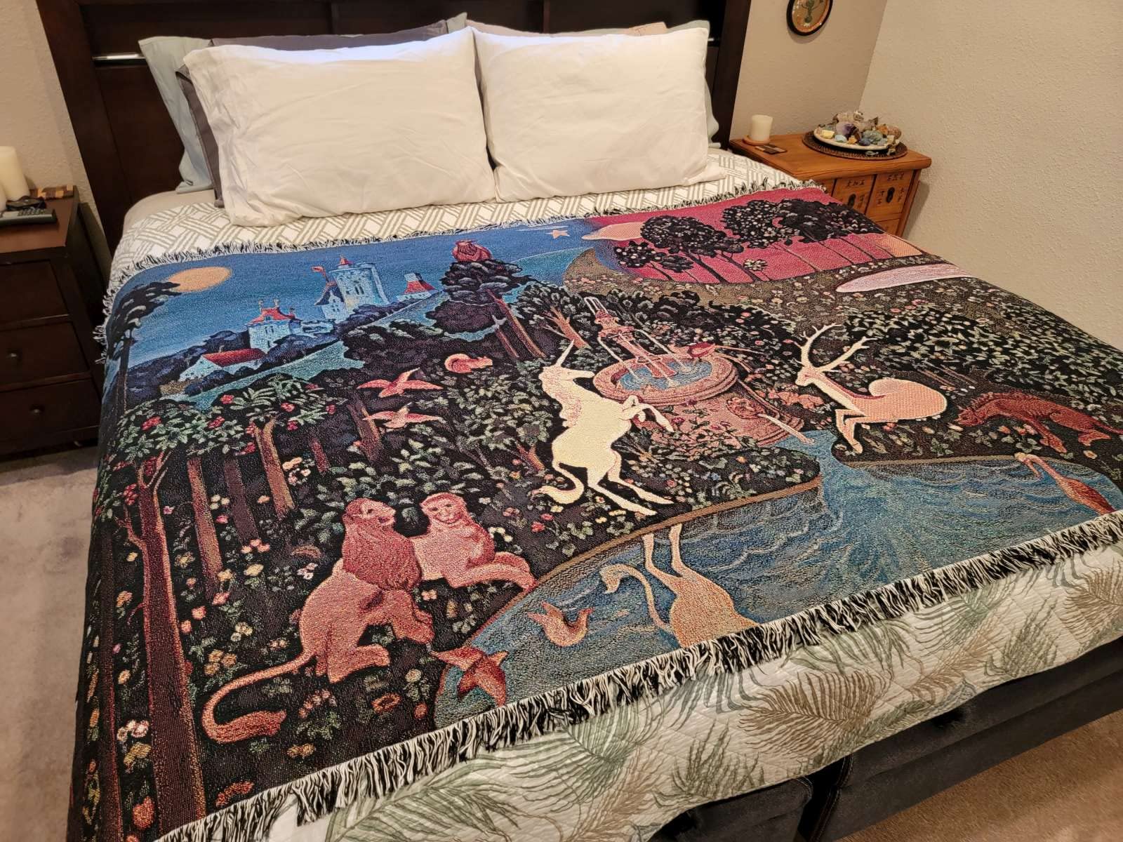Forest scene with unicorn, fountain and woodland creatures on The Last Unicorn tapestry