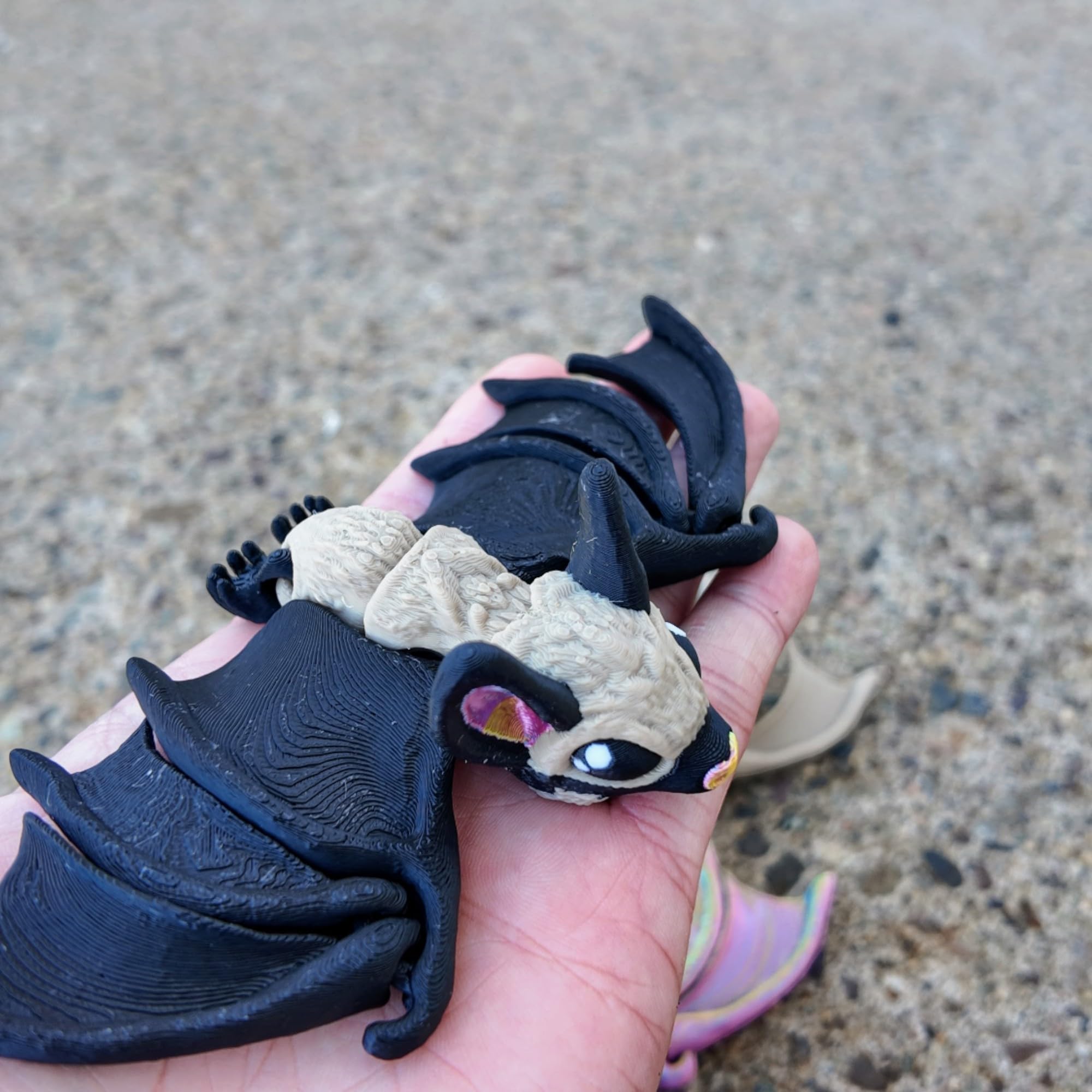 Tiny bat with articulated joints for fidgeting
