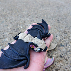 Tiny bat with articulated joints for fidgeting