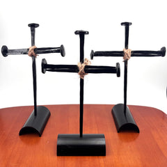 Three hand forged nails and base with hemp rope