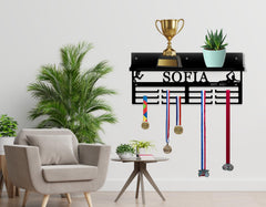 Trophy and medal display rack mounted on wall