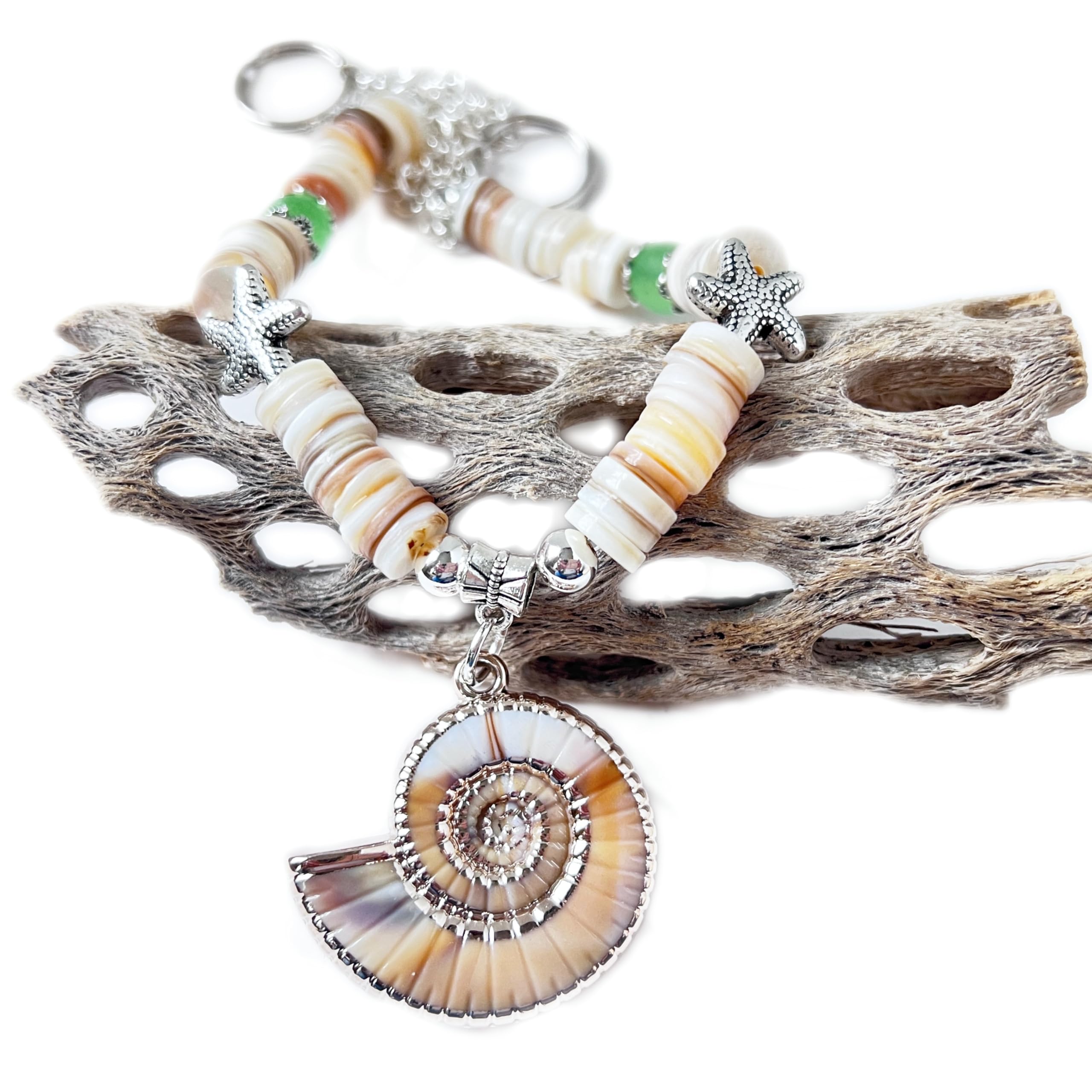 Coastal window accessory with sea shell pendant