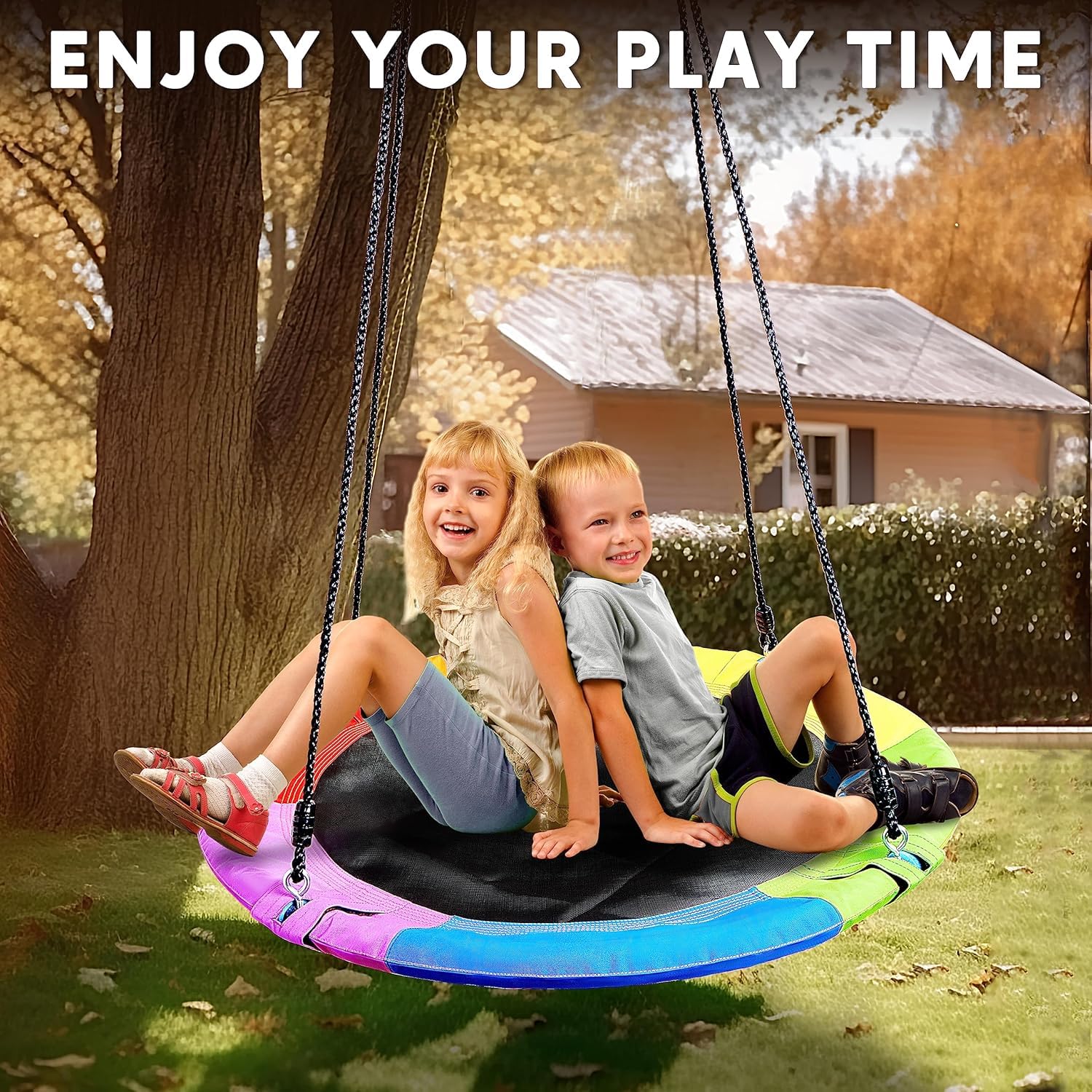 Backyard playground swing installed on a tree with rainbow color