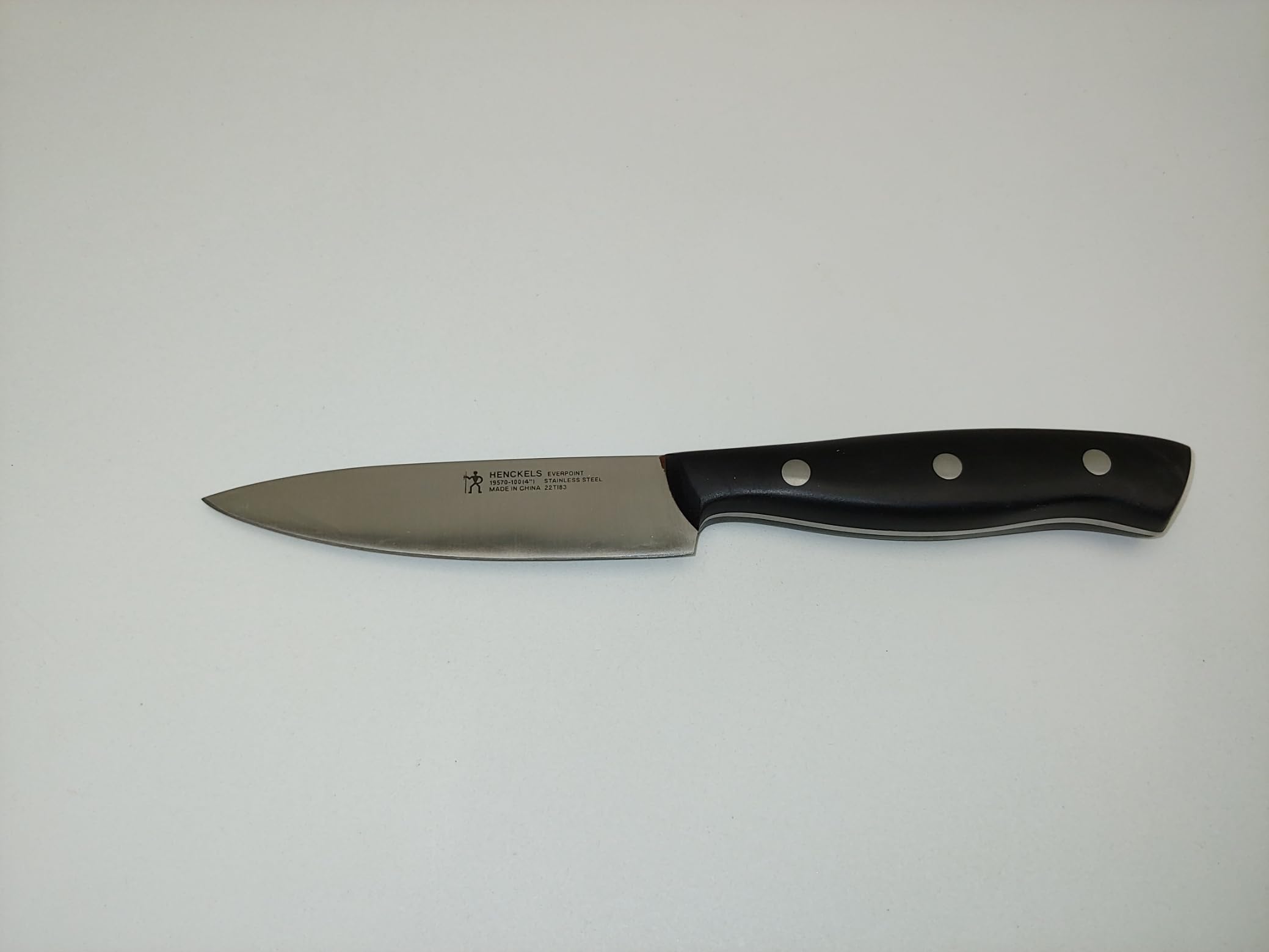 Henckels Everpoint 4 inch paring knives in focus