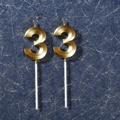 Two piece gold candles suitable for celebrations