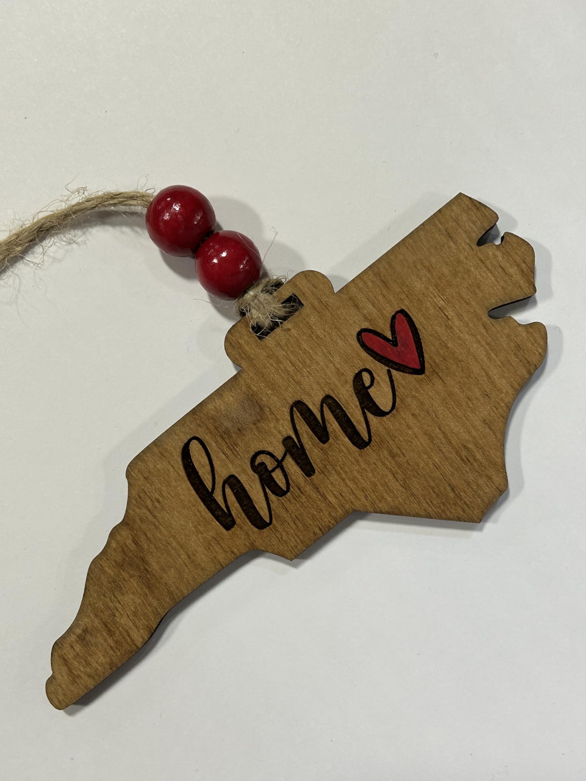 Ornament includes two wood beads for hanging