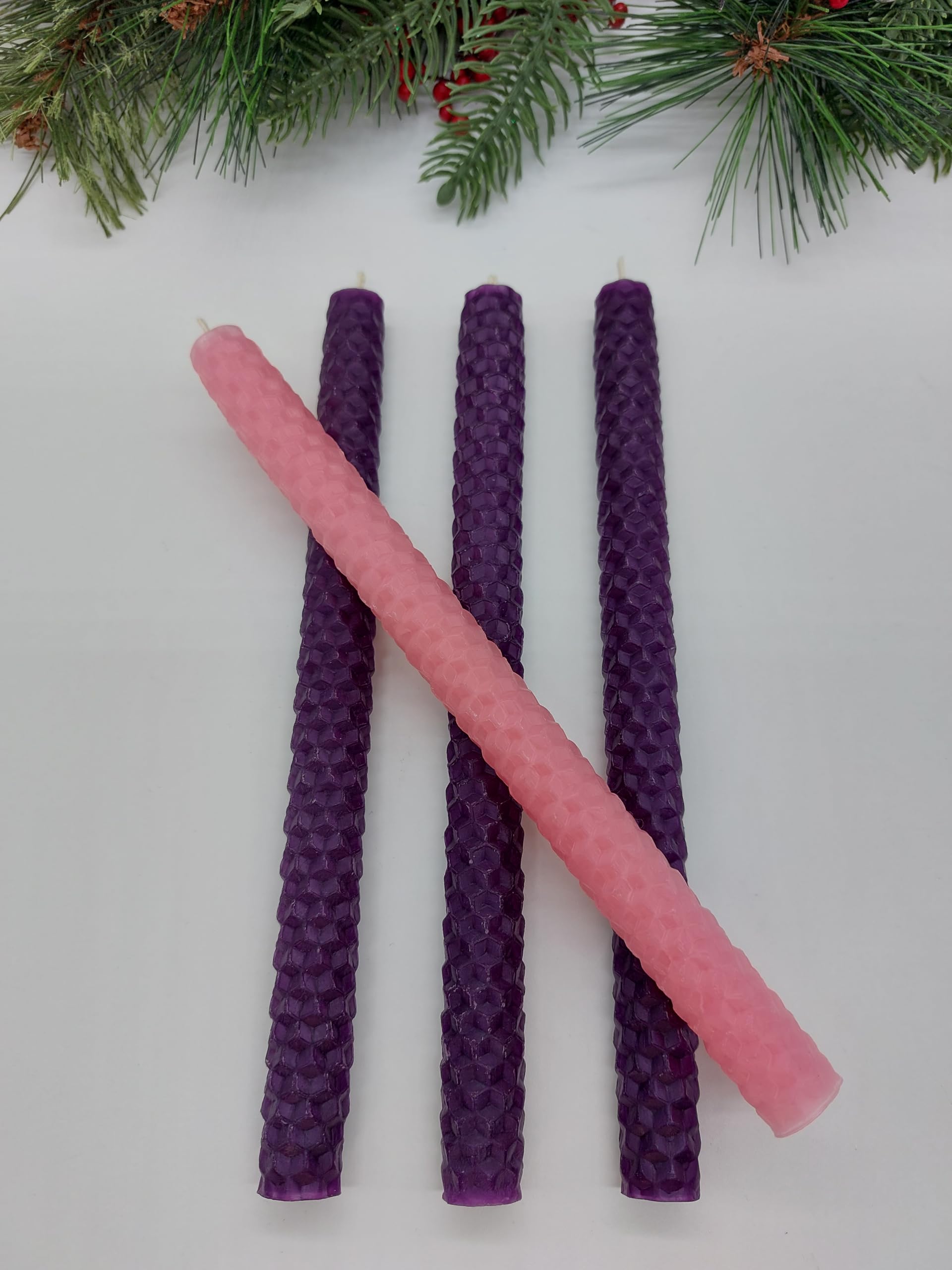 Three purple and one pink advent candle