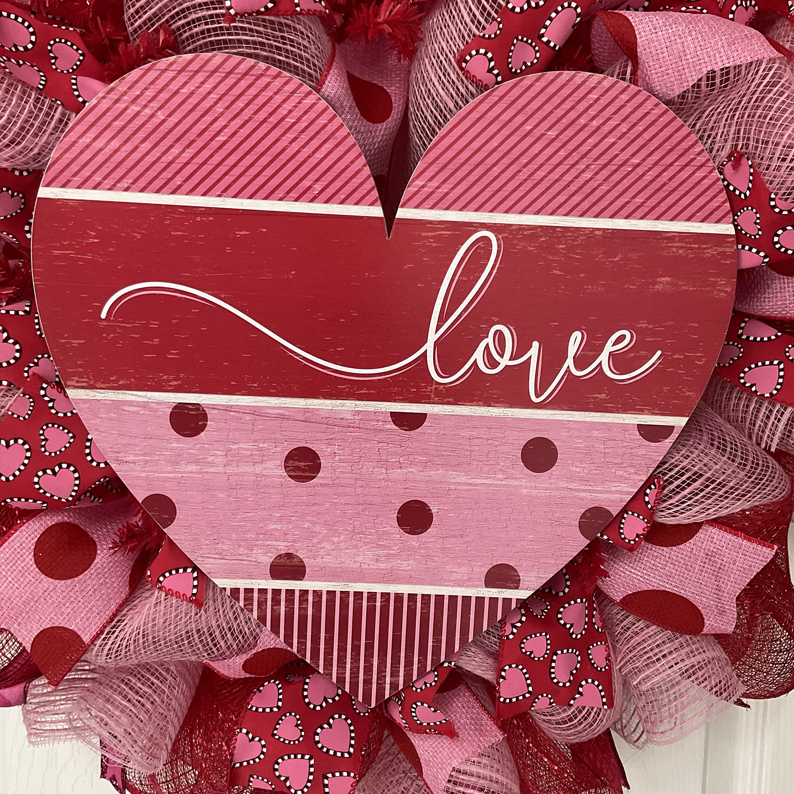 Soft pink fabric deco mesh with polka dot accents and love script on wreath