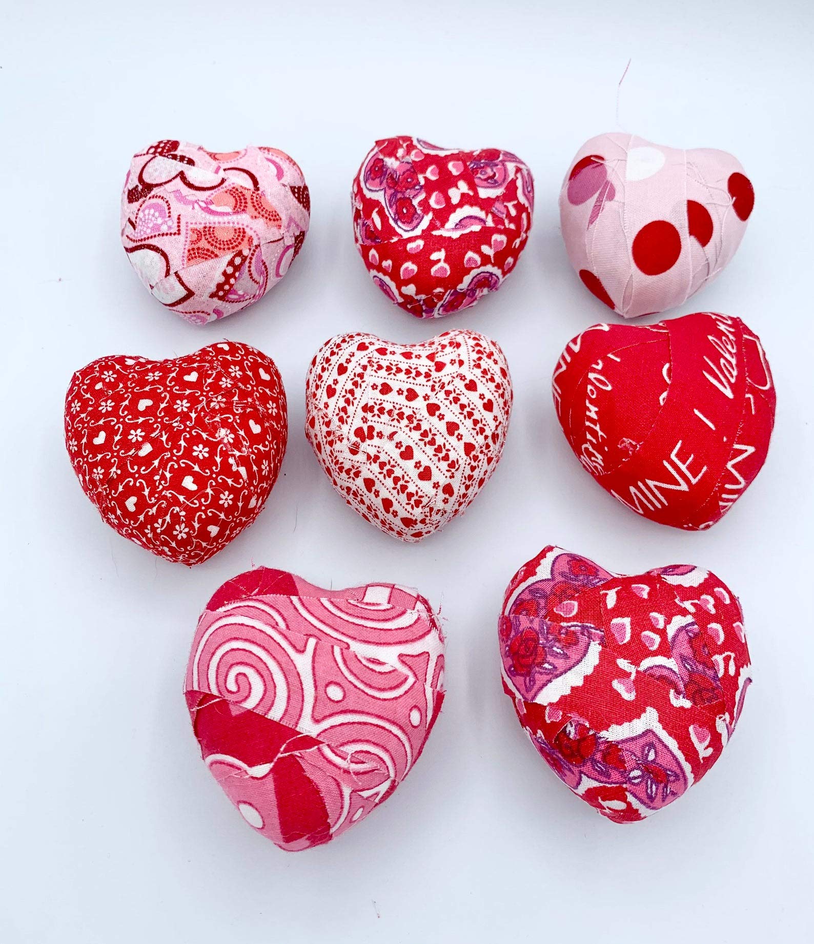 Set of 7 plastic hearts wrapped in red white pink fabrics