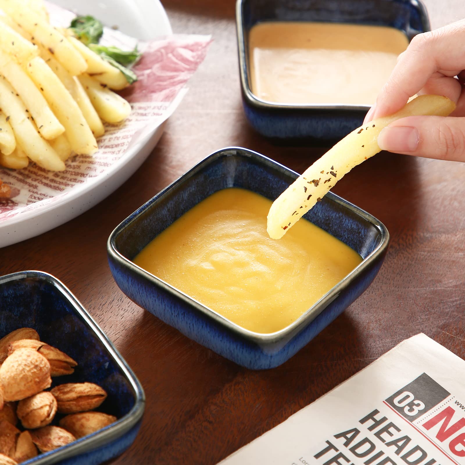 Soy sauce dips olives nuts salsa four bowls set for entertaining