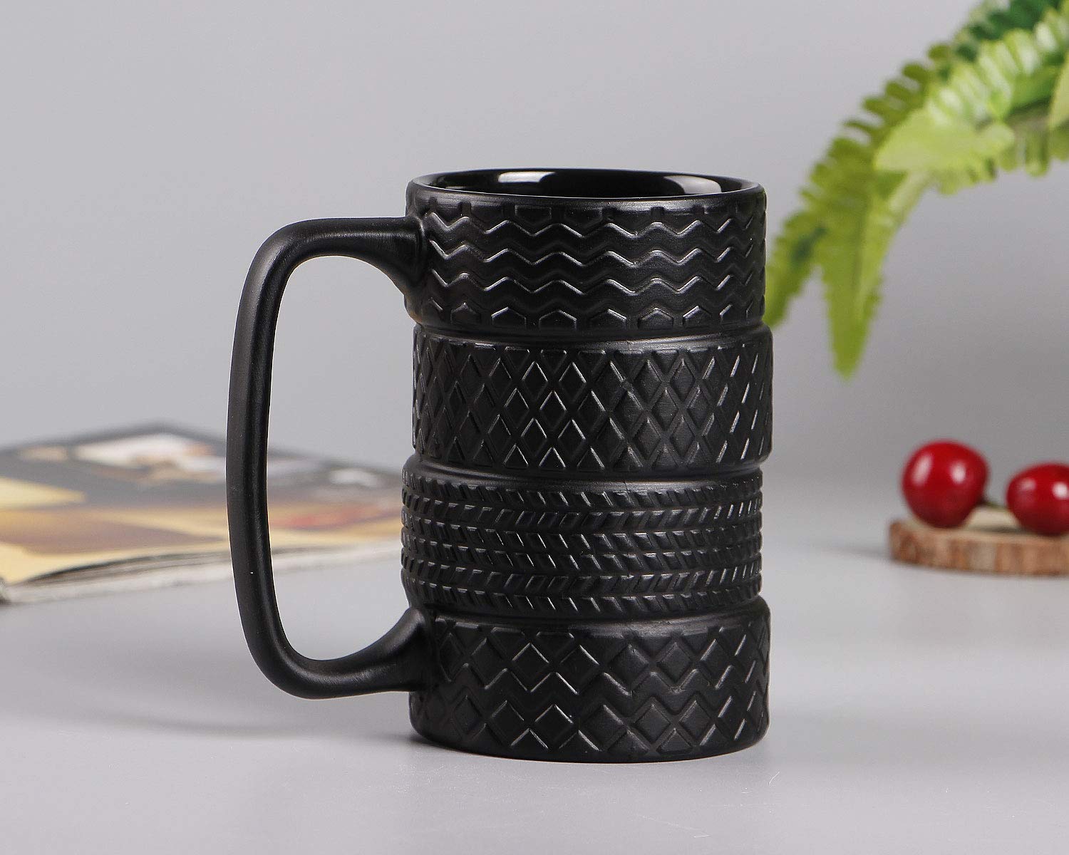 VanEnjoy black mug with tyre motif and glossy glaze