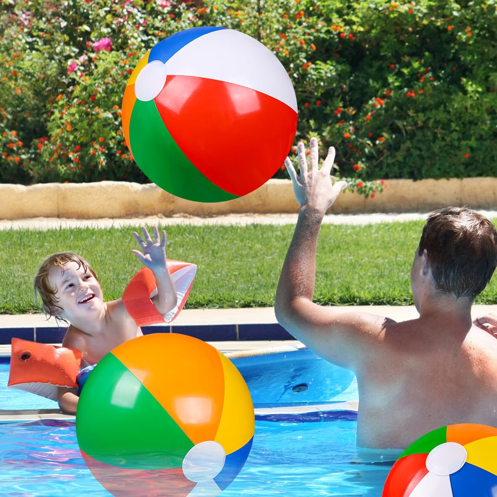 Bright rainbow beach balls float on water for summer games