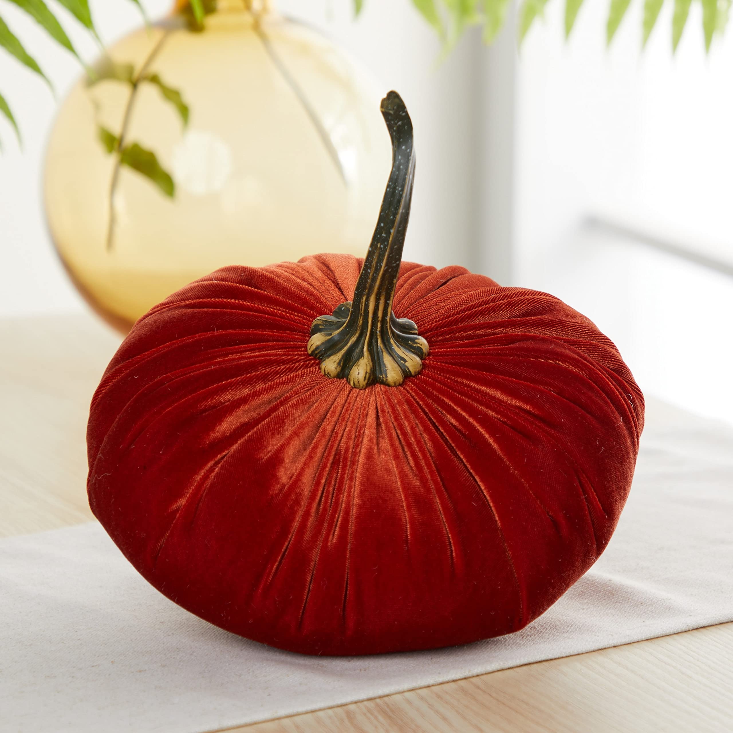 Resin stems on velvet pumpkins for realism