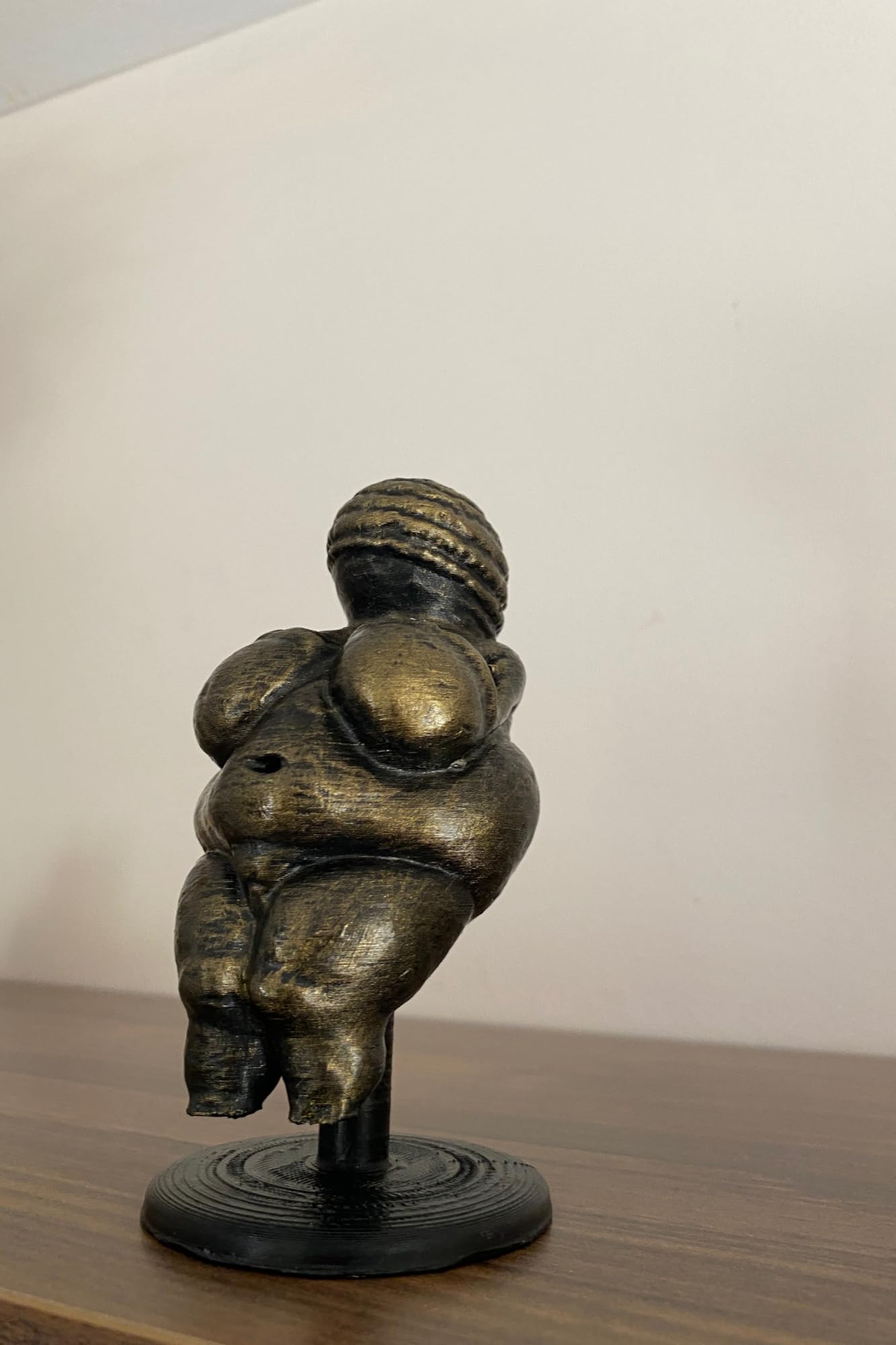 Archaeological Venus of Willendorf inspired figurine on display