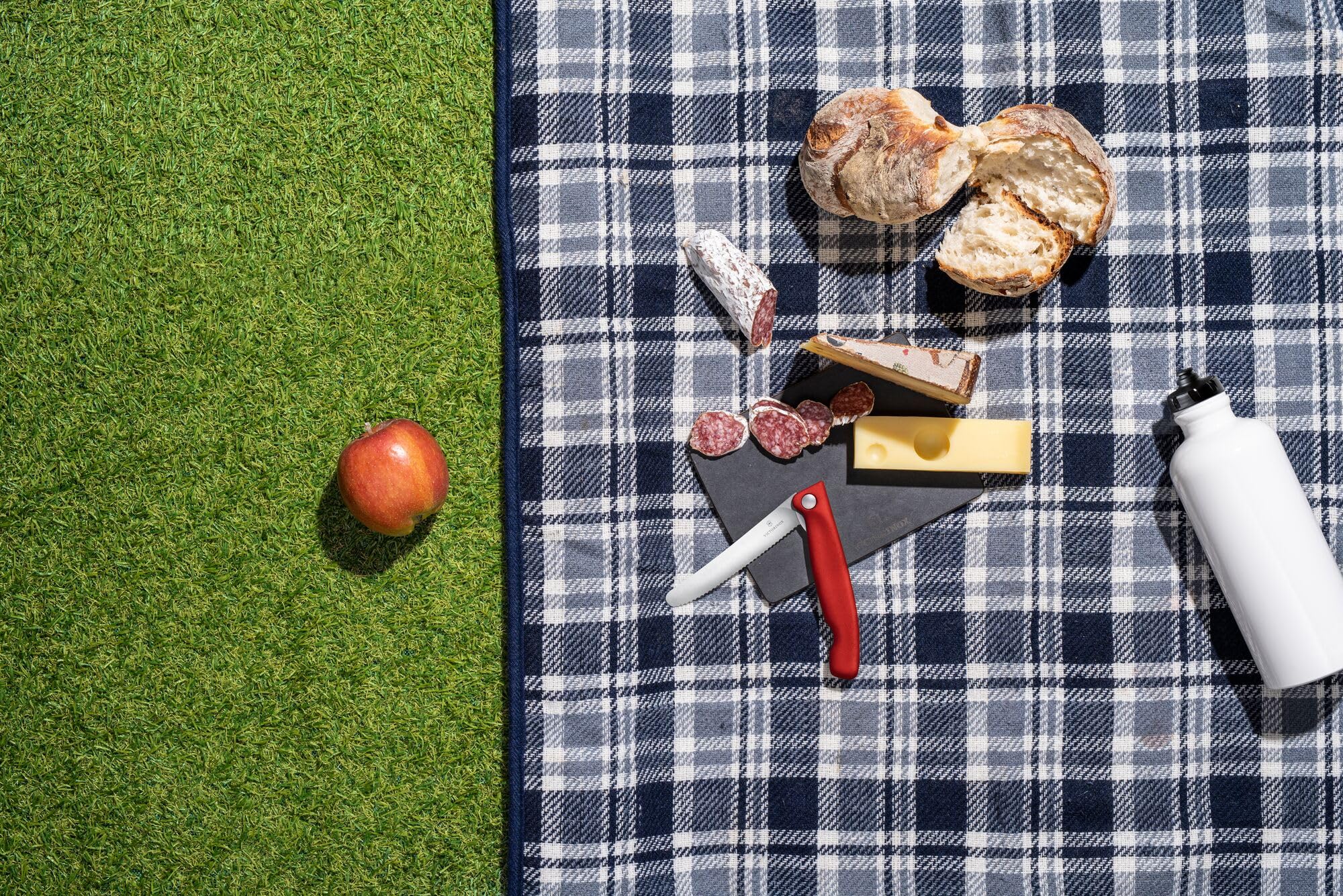 Wavy edge foldable paring knife by Victorinox in red