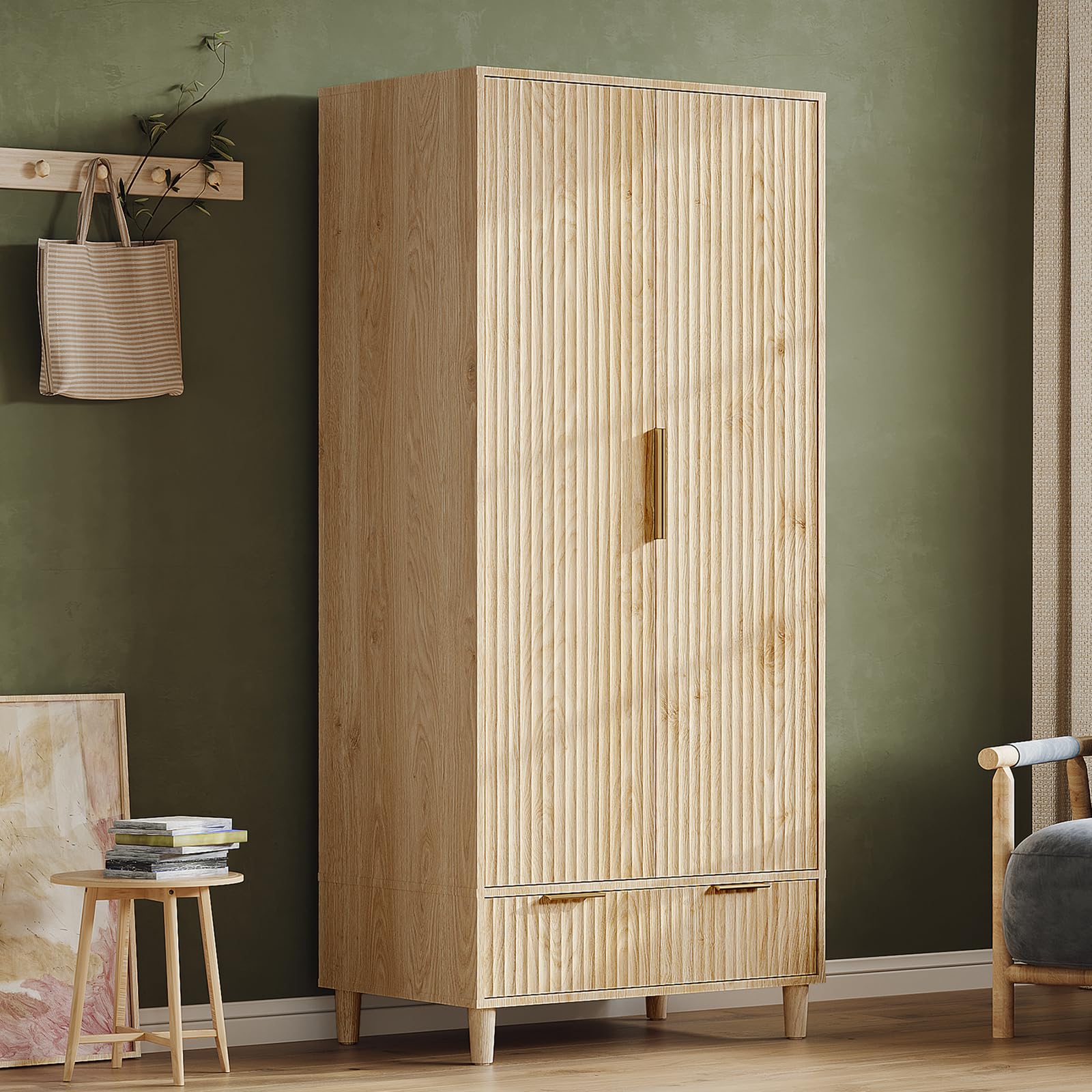 Fluted pattern and gold handle detail on armoire