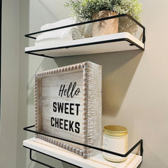 Vintage washroom sign featuring solid wood frame