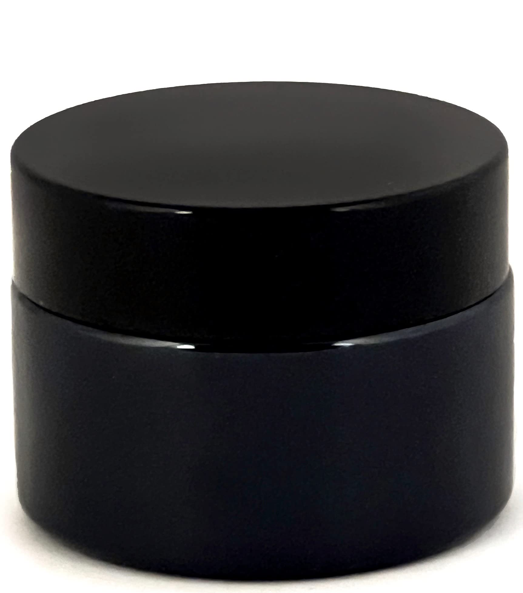 Set of 12 black glass jars arranged for packaging