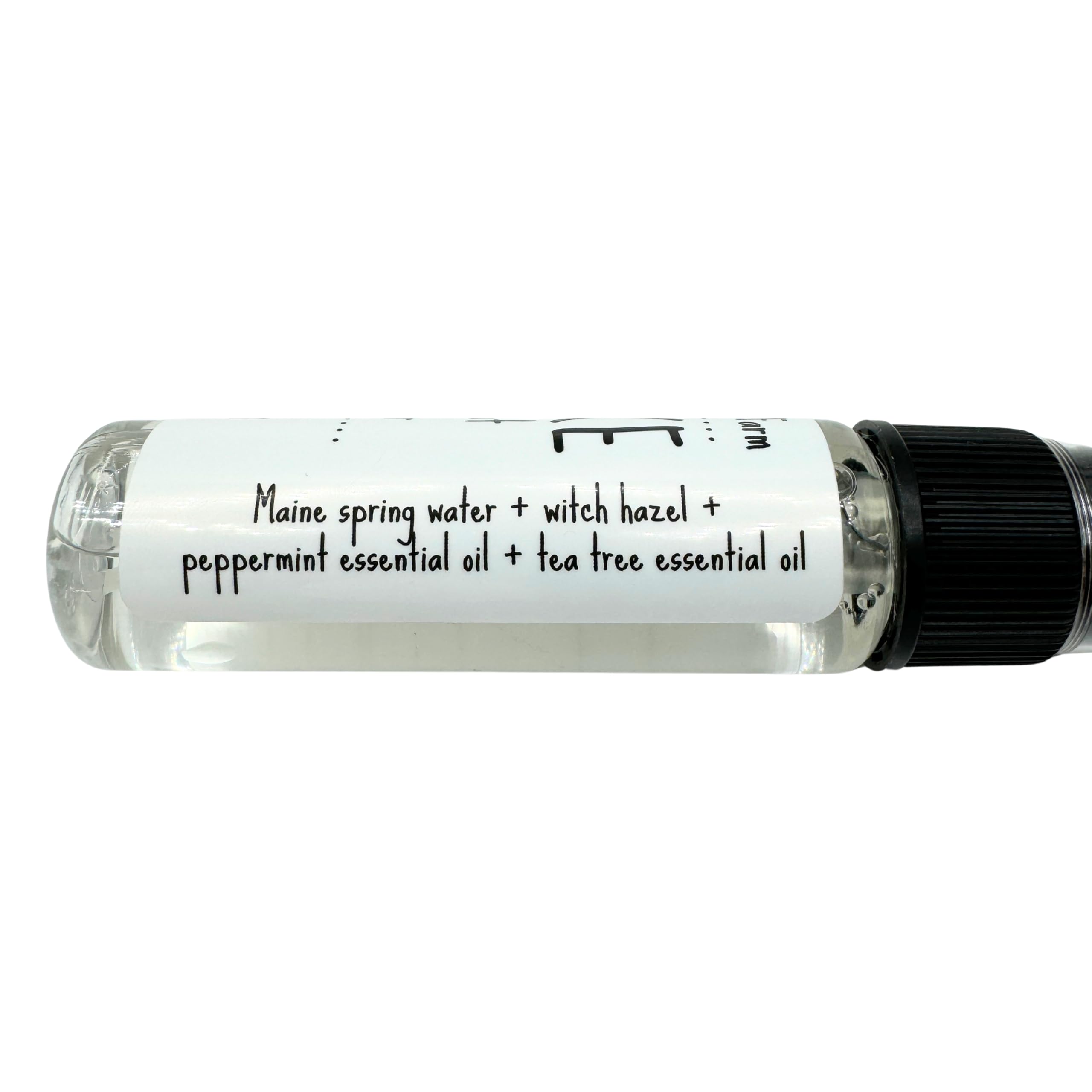 Close up of Awake Yoga Mat Cleanser bottle and ingredients