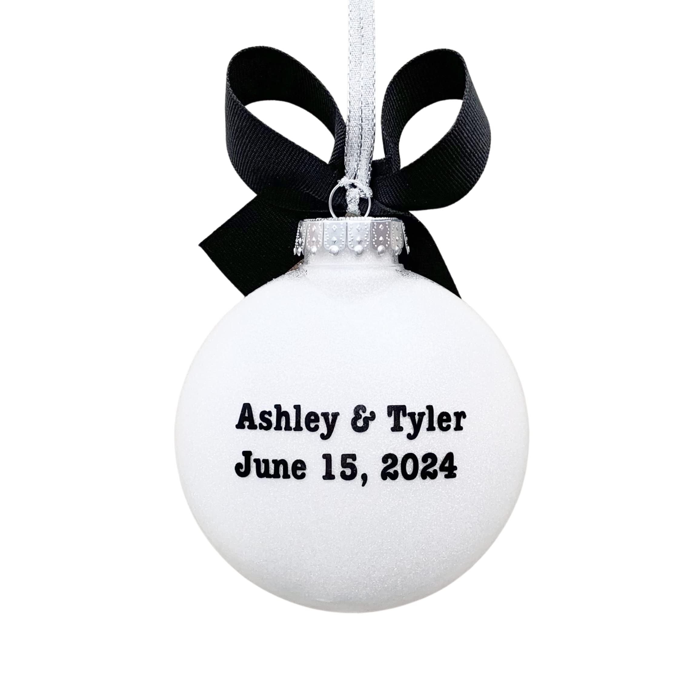 4-inch shatterproof plastic disc ornament with white glitter interior and grosgrain bow