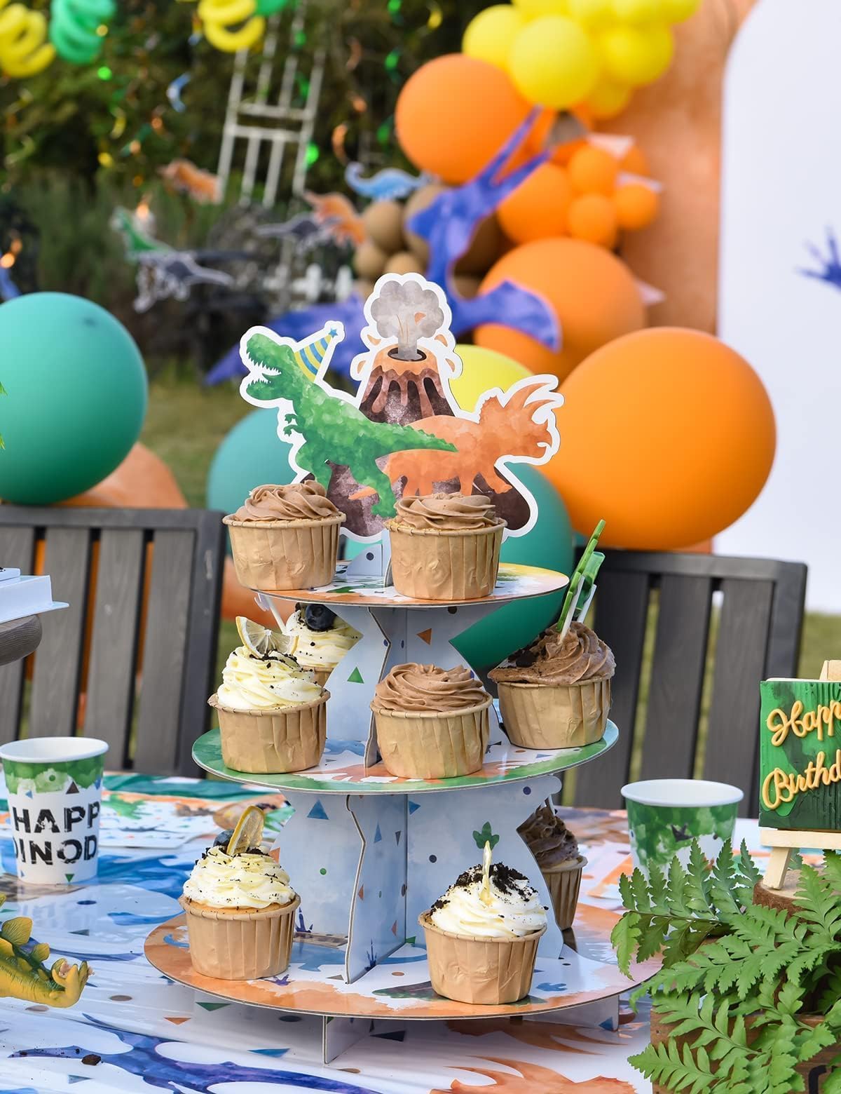 Dinosaur cupcake stand used as party decoration for birthday