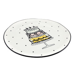 Whimsical cake artwork on ceramic serving platter for entertaining events