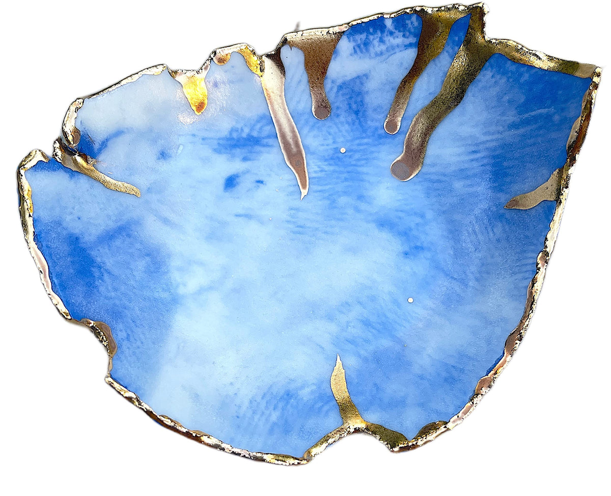 White blue and gold marbled ceramic ring dish close up