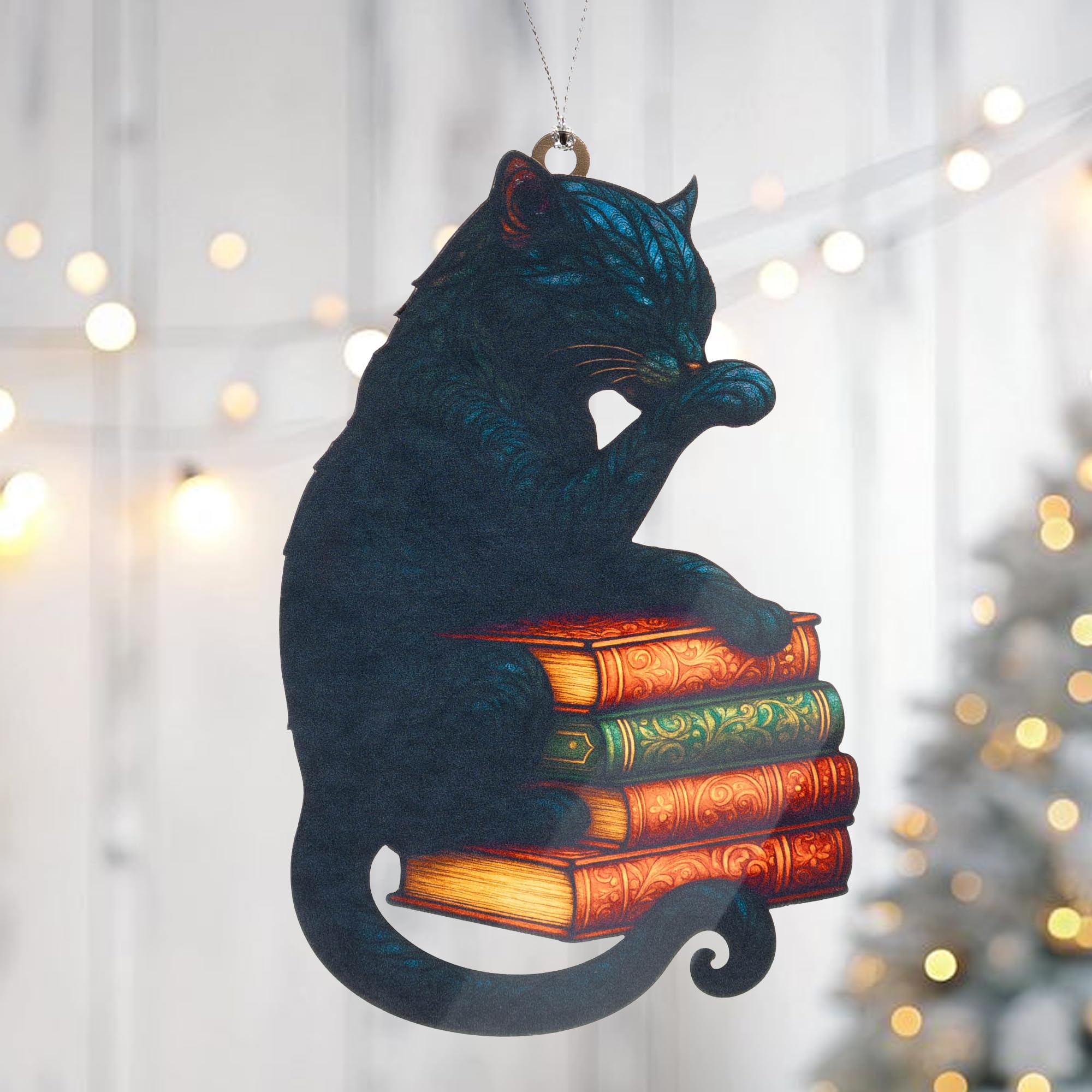 Seasonal cat ornament display with warm glow and presentation