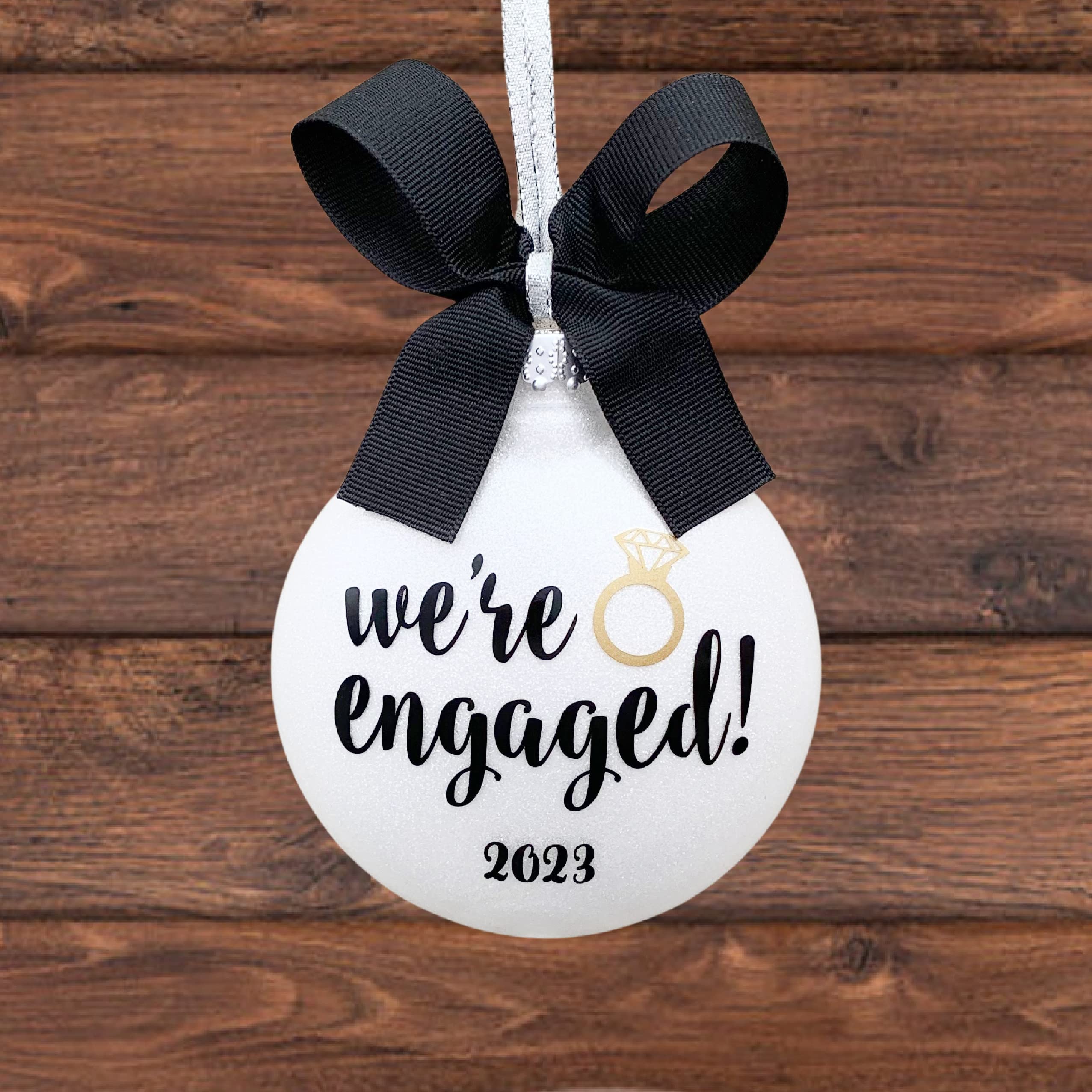 Includes one We're Engaged Ornament ready for customization on front and back