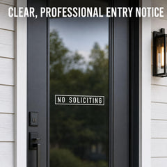 White reverse-cut lettering on interior glass for no soliciting decal