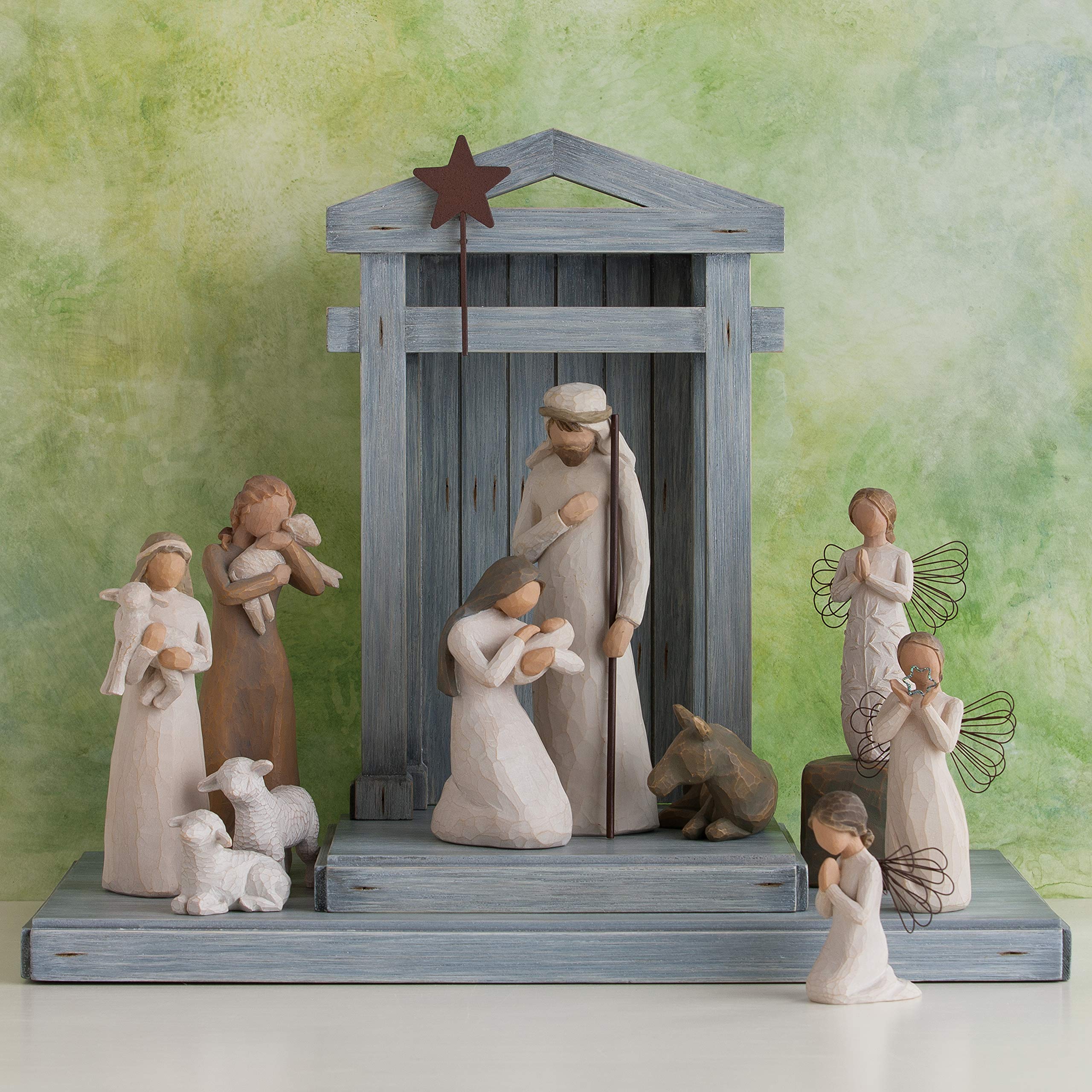Two white sheep figures one standing and one lying down