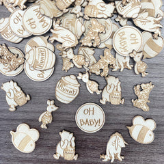 Winnie baby shower wooden confetti set on table