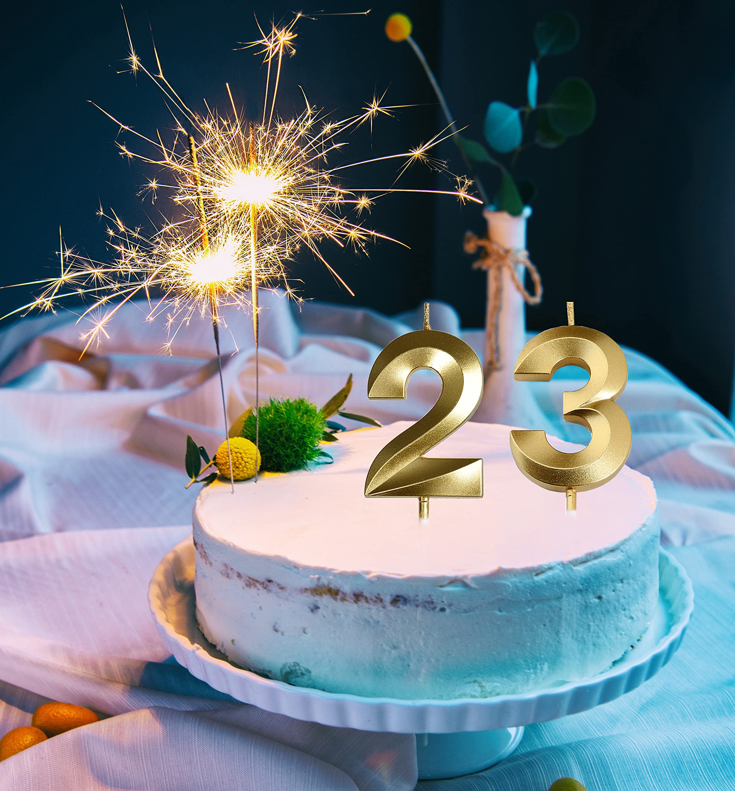 Women and men birthday decor with gold candles alt text