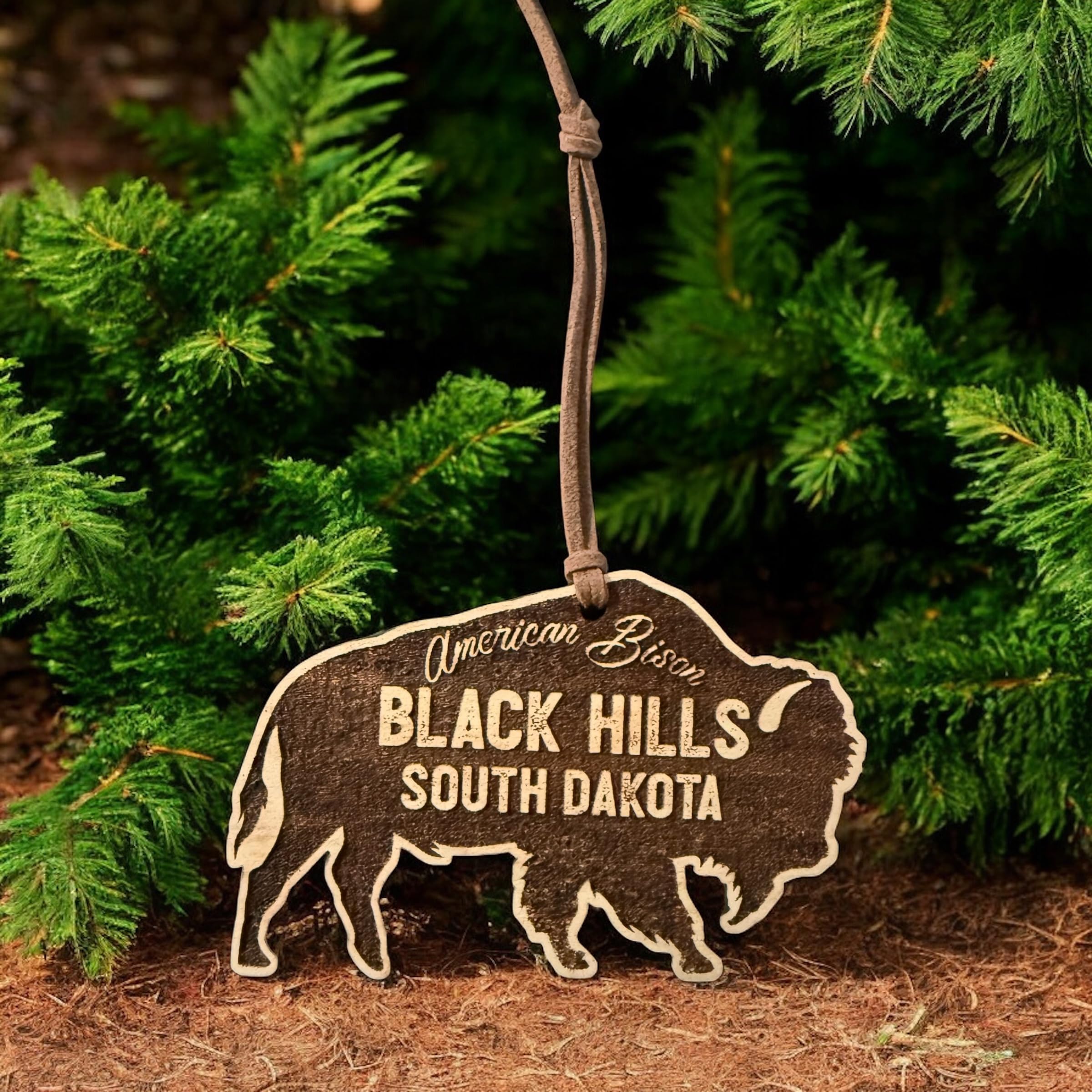 Bison ornament cut from solid cherry wood with natural back finish