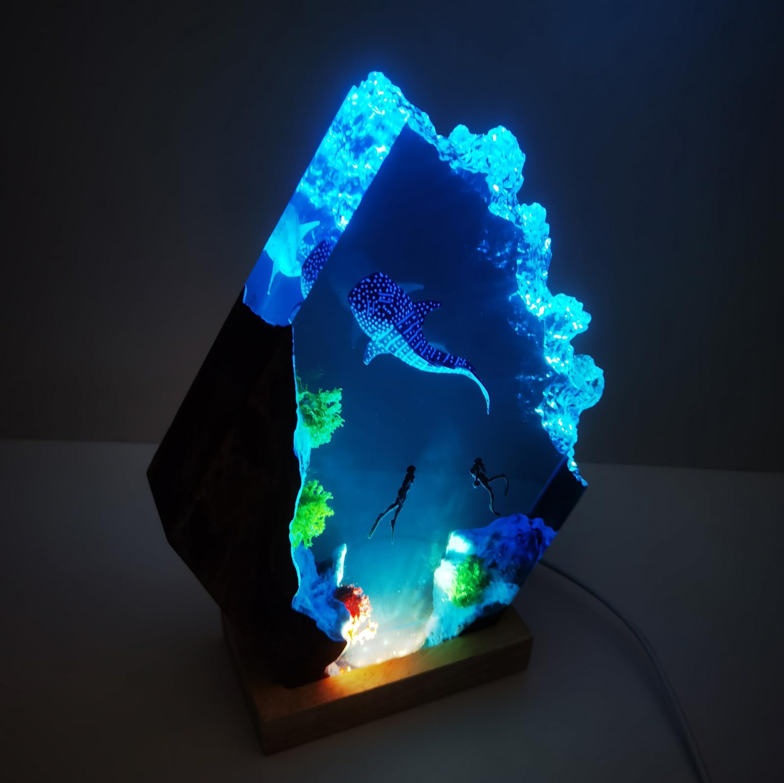 Wooden baset resin lamp close up showing ocean scene