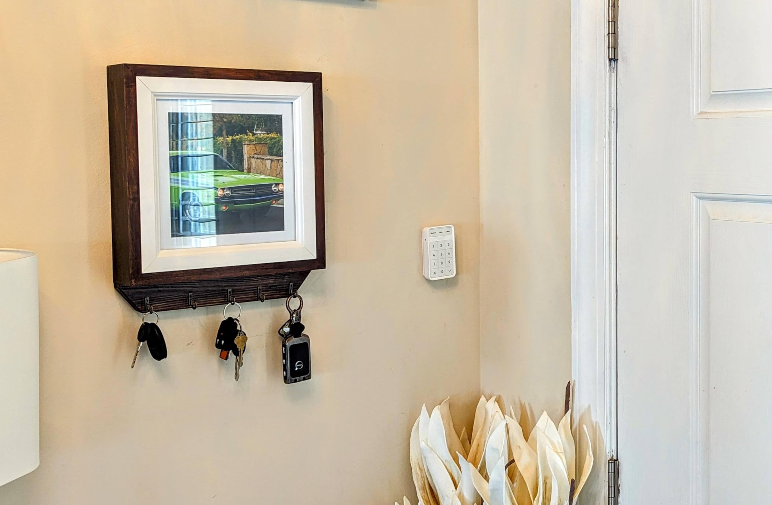 Photo frame and key holder integrated wall unit