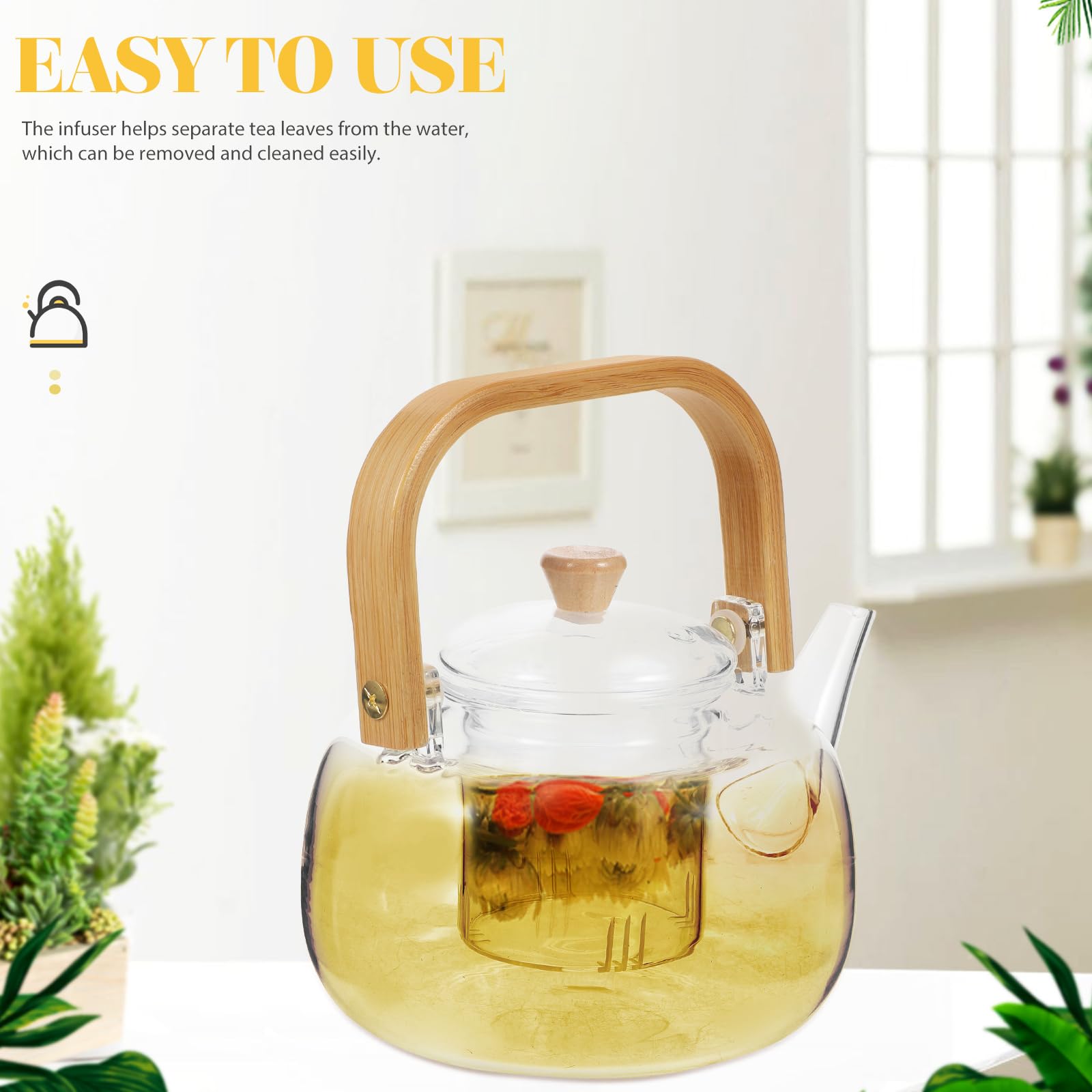 Blooming tea brewing in clear glass teapot